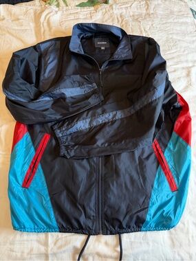 Bonobos Black Windbreaker with Blue Panels and Red Accents